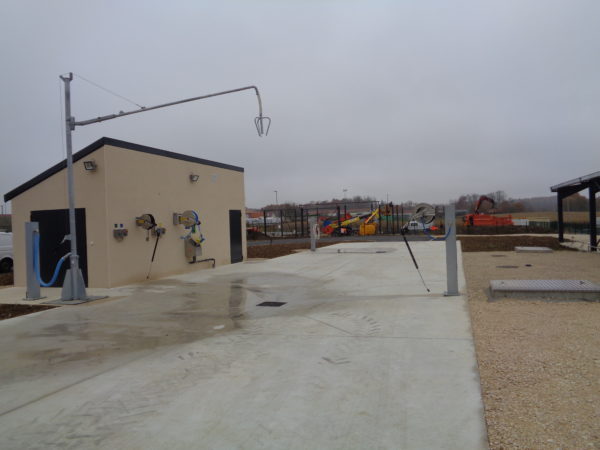 Agricultural sprayer filling washing area